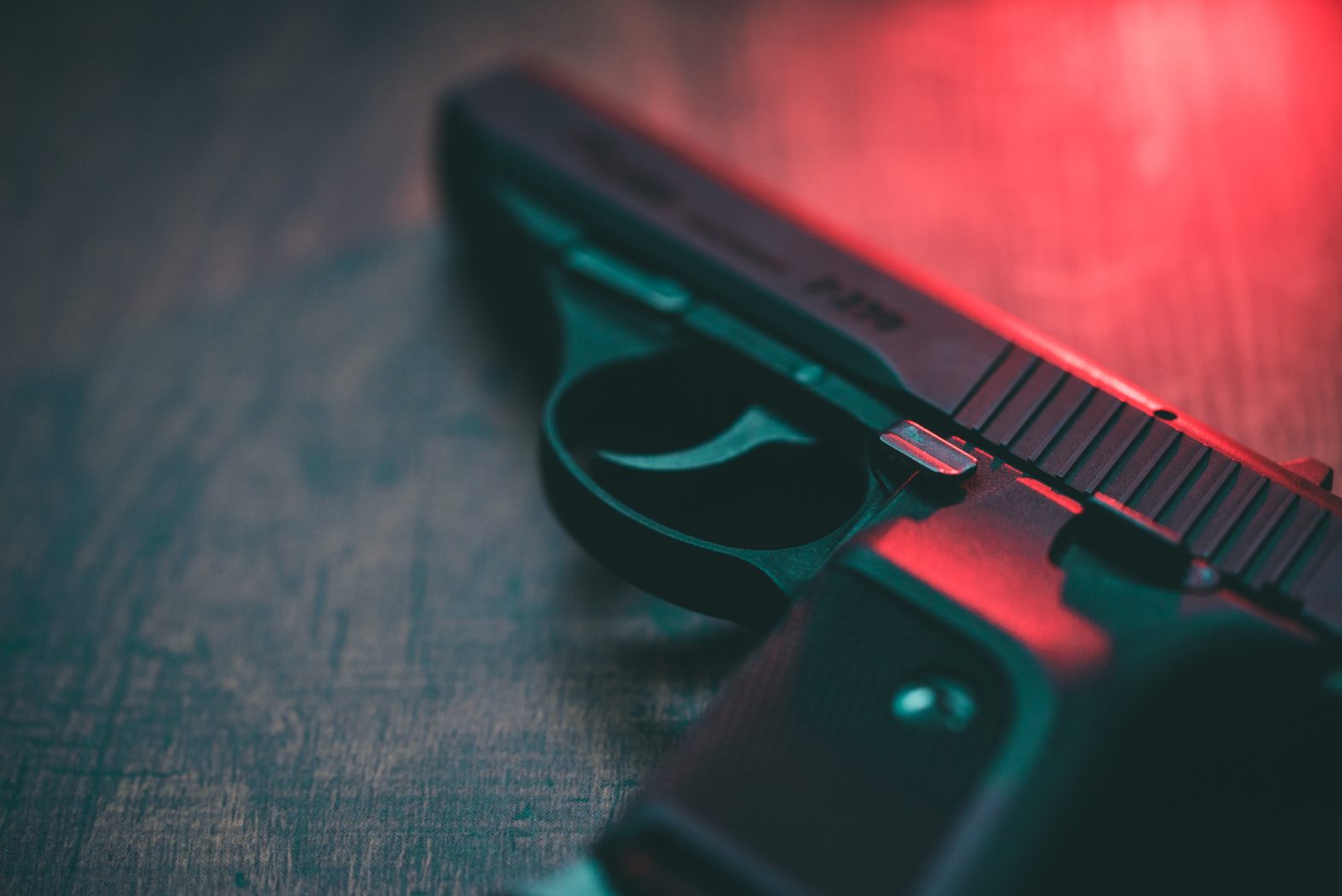 Semi automatic hand gun and red light.
