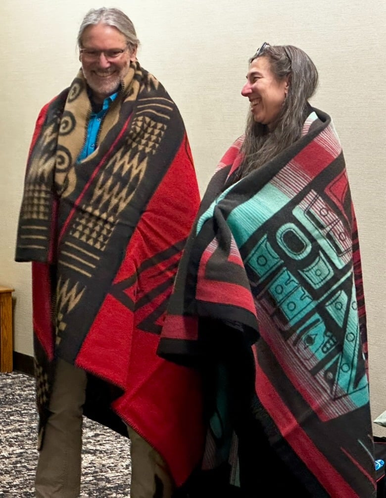 Lisa Wexler and James Allen in an honoring ceremony