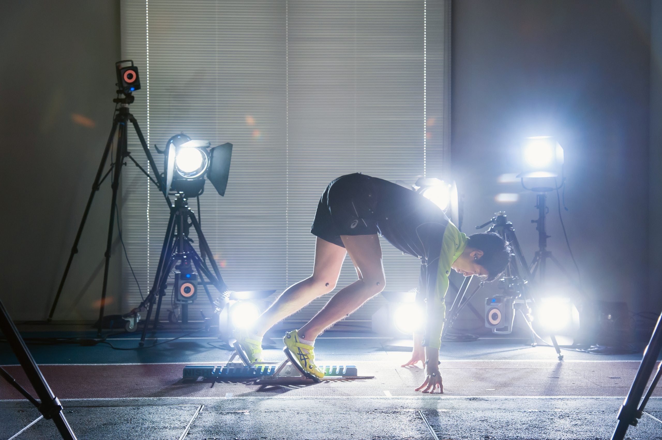 Athlete crouching in starting blocks