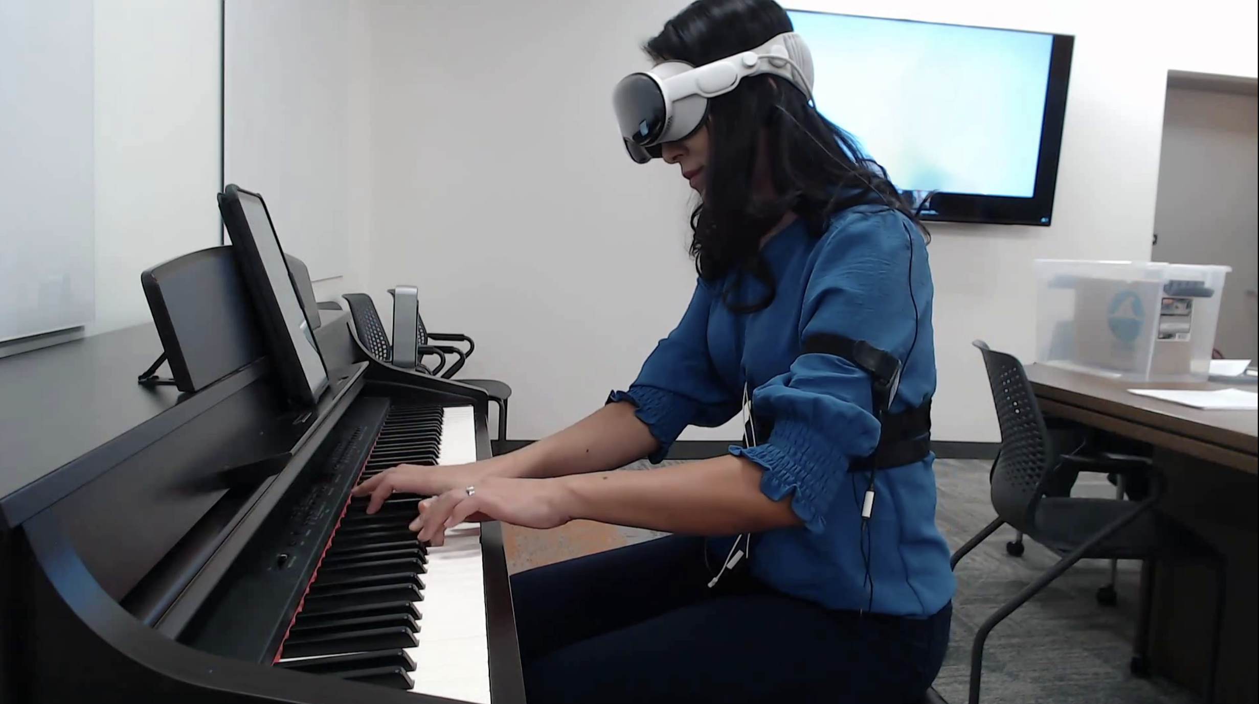 Pianist using VR to simulate performance environment
